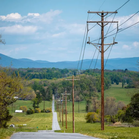 Rural power lines running through countryside landscape showing electrical utility access for a barndominium property