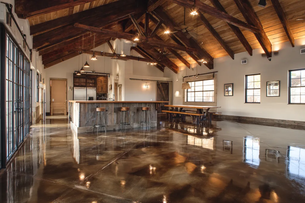 polished concrete floor in modern barndominium with open layout and natural light